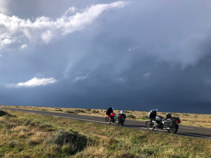 Stop to put rain pants on or wait 10 minutes for storm to clear