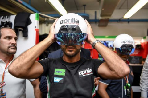 Mechanics from the team Gresini Aprilia use helmets augmented reality