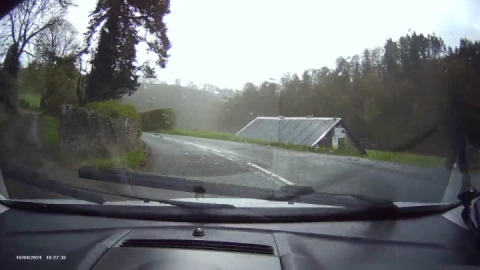 Enjoying the ever tightening bends on the A396 Exe valley road by car 