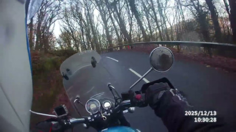 Riding the B3212 up the beautiful twisty hill towards doccombe before the road is closed .