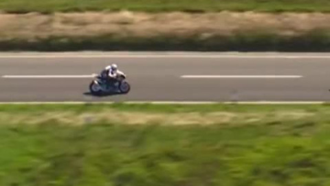 John Mcguinness and Michael Dunlop going full throttle through the mountain area.